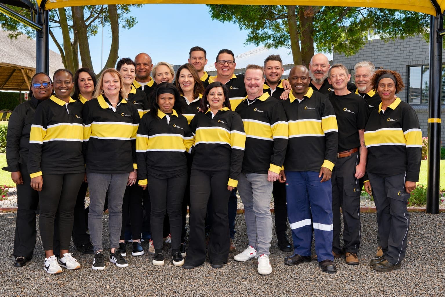 The MBT Petroleum team standing together on a forecourt