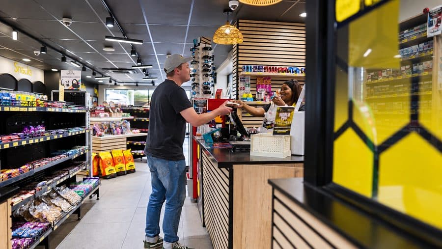 A customer being served at an MBT forecourt shop counter