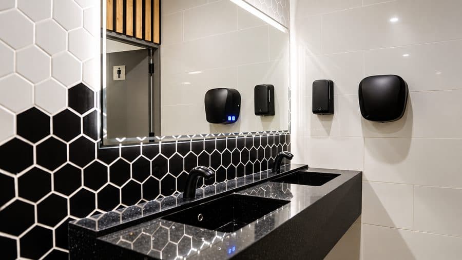 A clean, tiled washroom at an MBT station